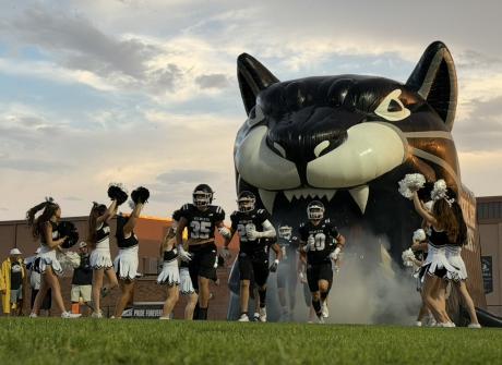 The Water Valley Wildcats run onto the field during the 2026 season.