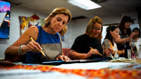 Military spouses learn how to write kanji at the Military and Family Readiness Center at Kadena Air Base, Japan, June 23, 2026. The MFRC connects service members and families with relocation, financial, readiness and support resources throughout their assignment. (Senior Airman Mason Hargrove/U.S. Air Force)
