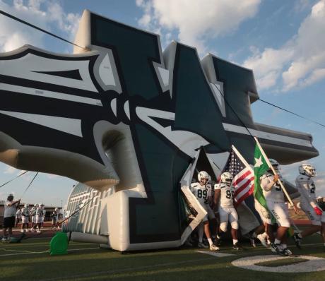 The Waxahachie Indians walk onto the field before a football game during the 2026 season.