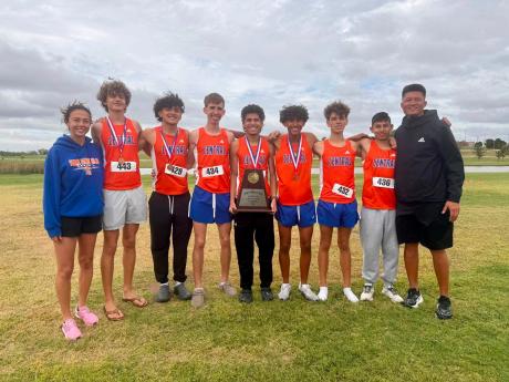 The Central boys cross country team defending its District 2-6A title Thursday, Oct. 15, in Lubbock.