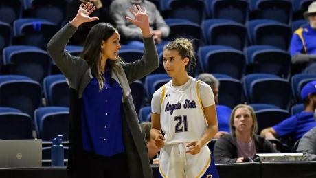 Angelo State women's basketball coach Alesha Ellis talks to Majik Esquivel during the 2025-26 season.