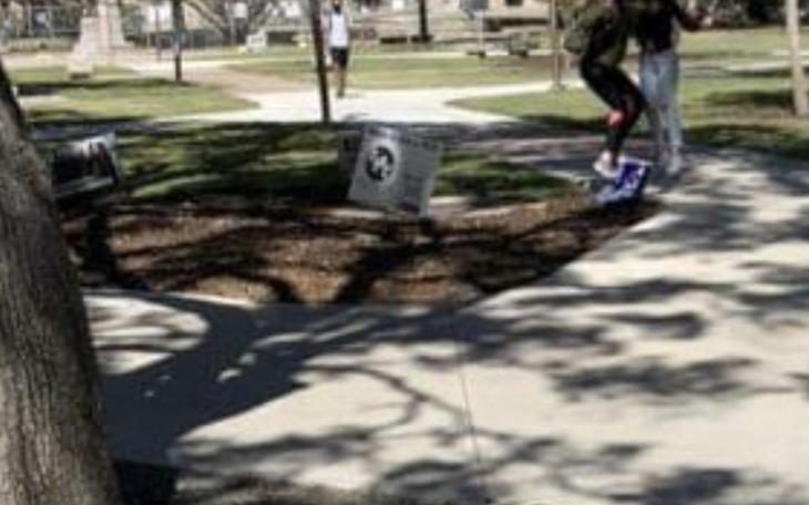 A photo where another student is allegedly destroying a Trump campaign sign