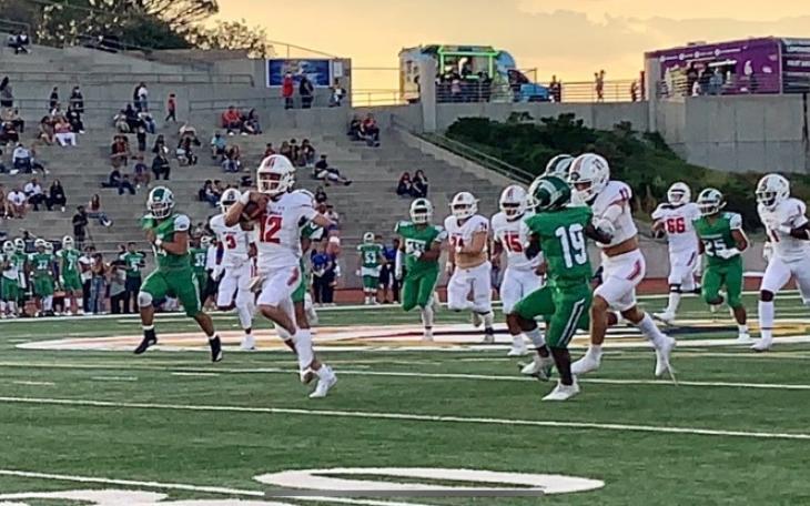 #12 QB1 Tyler Hill scores on a quarterback keeper against El Paso Montwood on Sept. 3, 2021.