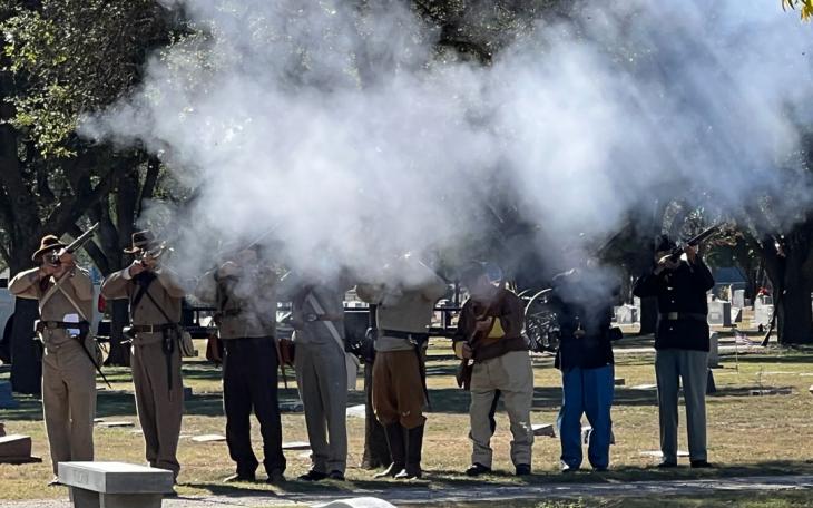 Sons of Confederate Veterans and Sons of Union Veterans perform a 21-gun salute at the Veterans Day memorial service at Fairmount Cemetery on Nov. 11, 2021