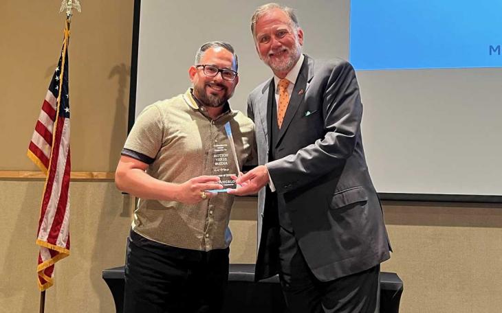 Manny Diaz accepts the 2021 Diversity Communicator of the Year award from San Angelo Chamber of Commerce President Walt Koenig.