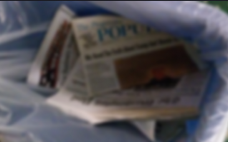 Newspaper in Trash