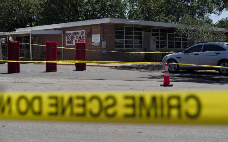 Crime scene tape surrounds Robb Elementary School in Uvalde, Texas, Wednesday, May 25, 2022.