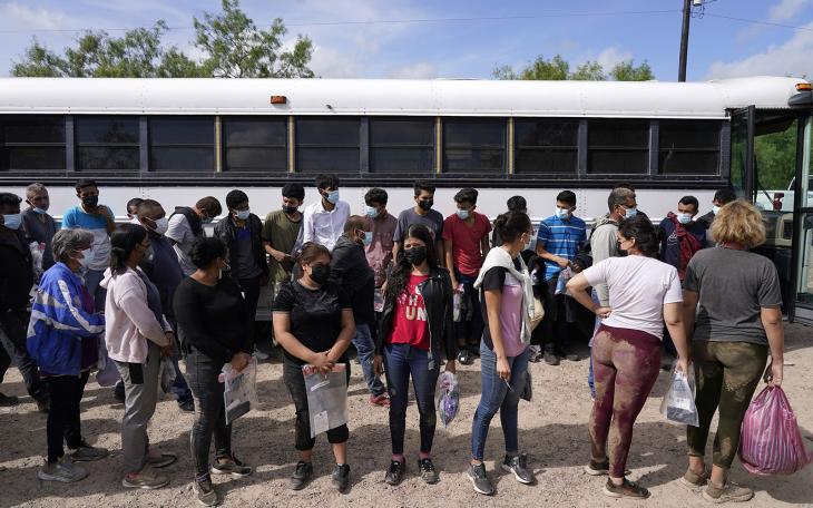 Migrants board a US Border Patrol bus for the detention center on the second day of the implementation of the "Credible Fear and Asylum Processing Interim Final Rule" on June 1, 2022 in La Joya, Texas, USA.