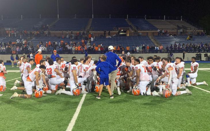 Bobcats Head Coach Kevin Crane congratulates team after grueling 28-25 win over Midland on Oct 7, 2022