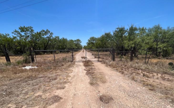 A gate facing US 67 that could lead to the location of the proposed new landfill.