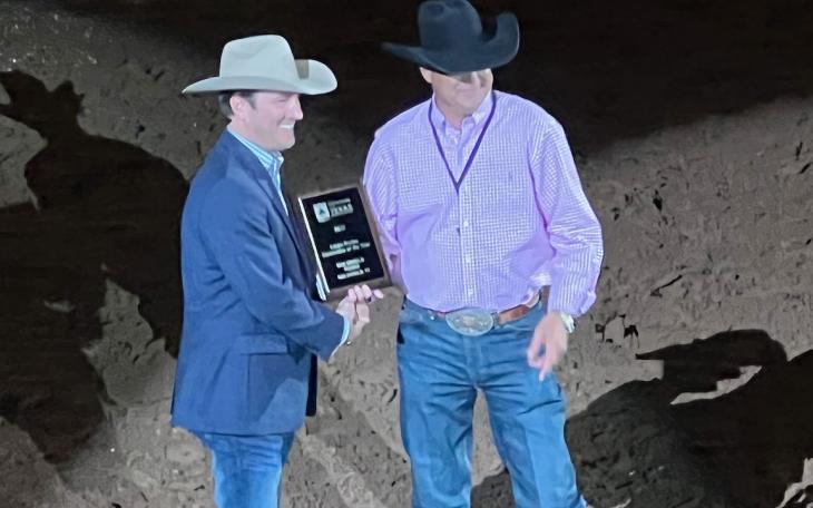 San Angelo Stock Show and Rodeo Assoc. Director Justin Jonas (left) receives the award for "Best Large Rodeo" from the Waco rodeo association president and CEO Wes Allison at the Waco rodeo performance on Oct. 13, 2022.