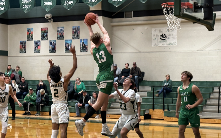 Wall's Everson Armstrong rebounds the Basketball.