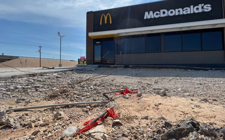 The new parking lot was poured and shortly thereafter demolished over quality concerns.