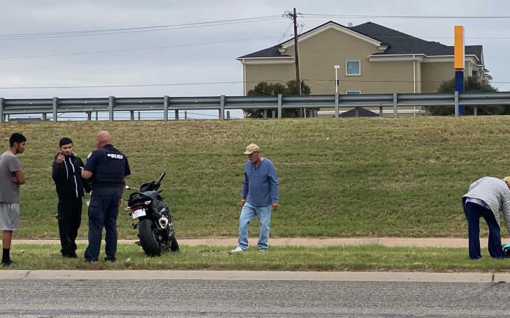 A minor accident occurred on the eastbound service road adjacent to the Houston Harte Expressway, involving a high-performance motorcycle.