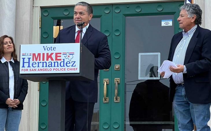 Mike Hernandez (center) flanked by his wife, Lisa, and his campaign manager Del Velasquez.
