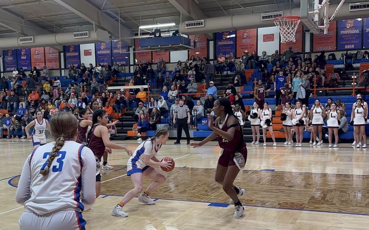 Lady Cats Anna Wierzowiecki drives to the basket against Midland Legacy