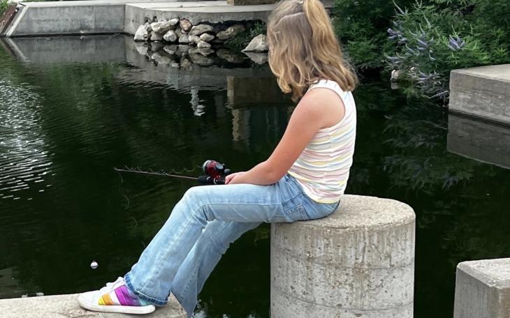 Young Lady Fishing in the Concho River Near Art Museum