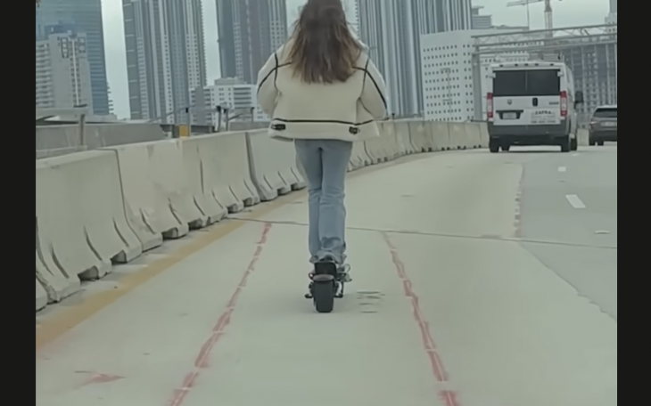 Screen Shot of Girl on Scooter From Youtube