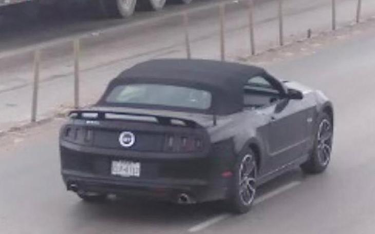 The black 2014 Ford Mustang that the shooter stole from the dead homeowner.