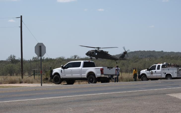 The National Guard joined in the effort to fight wildfires outside Mason on Friday afternoon by deploying helicopters, including one loaded with water to drop on the fires.