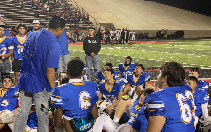 Owls defensive coordinator Willie Rangel addresses the team after a 32-0 win over the Olney Cubs.