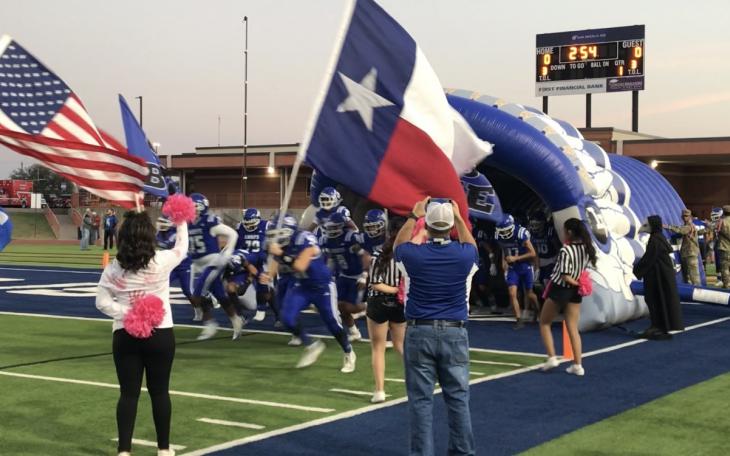 The Lake View Chiefs football team charges out of the tunnel before its game against Big Spring on Thursday, Oct. 31, 2024, at San Angelo Stadium.
