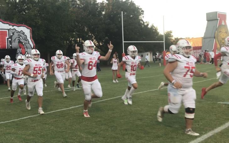 The Miles Bulldogs run out of the tunnel before their game against Albany on Friday, Oct. 11, 2024.