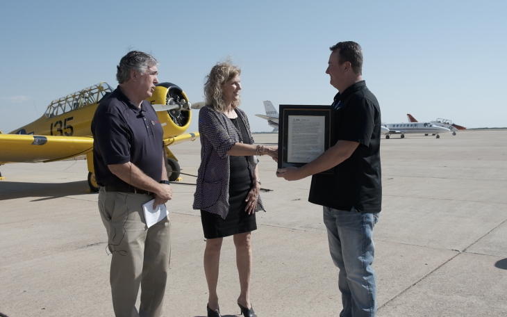 Kevin Long pictured on the right accepting his award