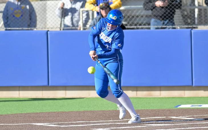 Angelo State's Carter Smith makes contact during a softball game in the 2025 season.