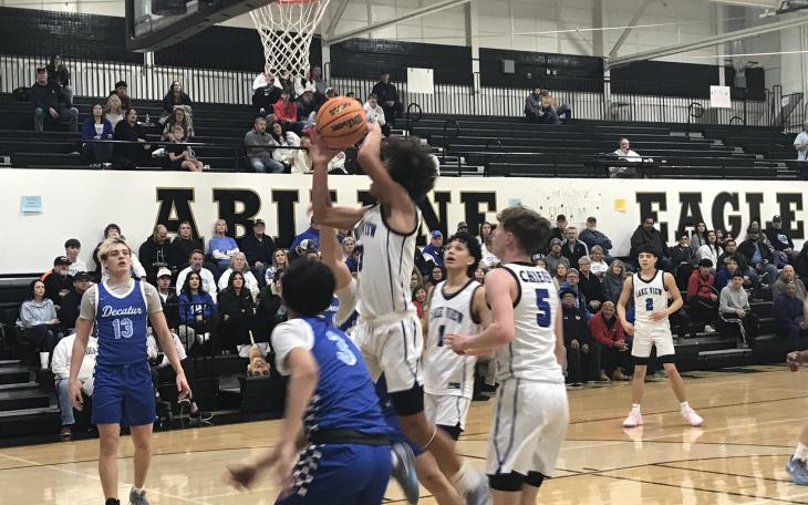 Lake View junior guard Braylon White drives to the basket against Decatur in their second-round playoff game Friday, Feb. 21, 2025.