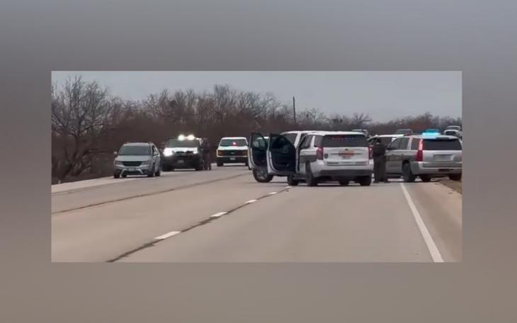 Law enforcement officers surround a vehicle on US Highway 67 near Barnhart after a pursuit ended Sunday afternoon. Reagan County and Irion County deputies detained the suspect without incident, temporarily shutting down the highway. (Photo: Ivan Patiño / The Big Lake Wildcat)