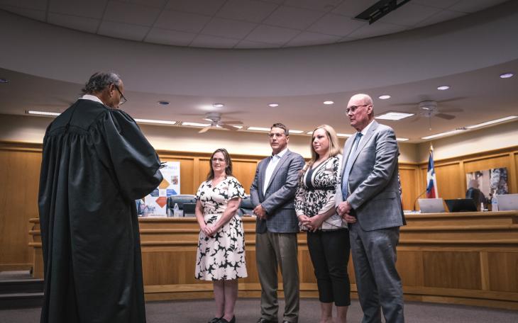 Judge Gonzalo Rios administers the oath of office to newly elected and returning San Angelo ISD trustees, from left: Ami Mizell-Flint, Dr. Taylor Kingman, Karla Cardenas, and Bill Dendle, during the May 19, 2025, board meeting.