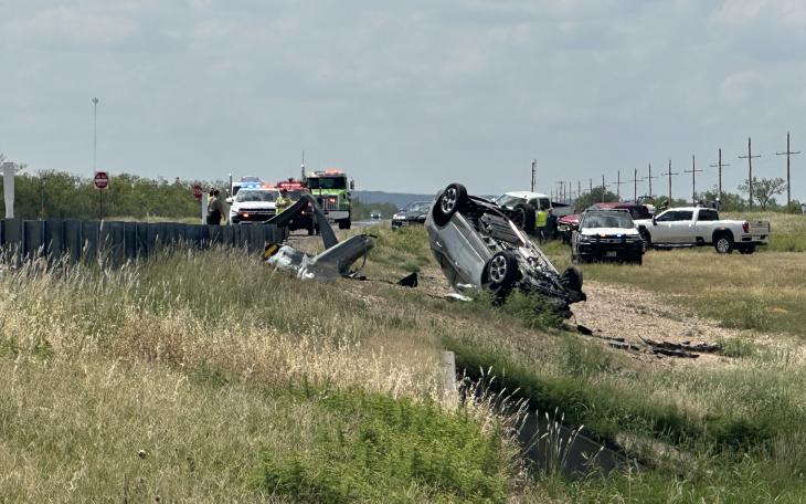 A car flipped onto its roof after slamming into a guardrail outside Carlsbad Monday afternoon.