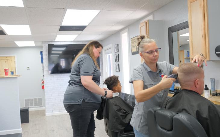 Hair stylists work at Kickin Kuts, a new barber shop on Sherwood Way.