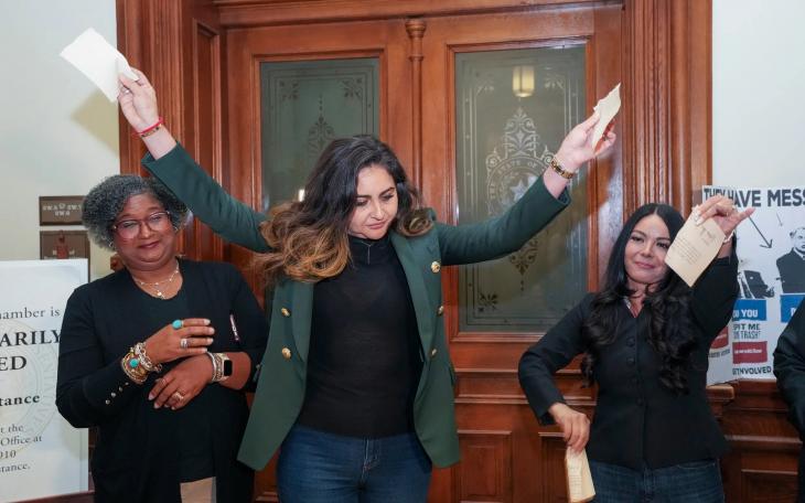State Rep. Mihaela Plesa, D-Plano, rips up her "permission slip" in front of the Texas House, vowing she will stay the night in the House Chamber in support of fellow Democrat Nicole Collier on August 19, 2025. At left is Rep. Rhetta Bowers, D-Garland, at right is Rep. Cassandra Garcia Hernandez, D-Farmer's Branch.