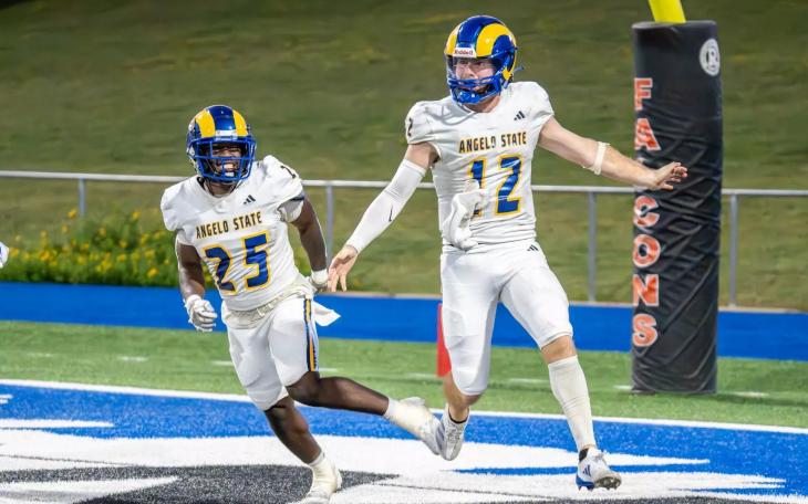 Angelo State quarterback Braeden Fuller and running back Jayden Jones celebrate a touchdown against UT Permian Basin during the 2024 season.