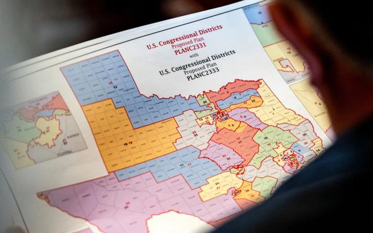State Rep. Matt Morgan, R-Richmond, surveys a map of proposed new congressional districts in Texas, as Democratic lawmakers, who left the state to deny Republicans the opportunity to redraw the state's 38 congressional districts, began returning to the Texas Capitol in Austin on Aug. 20, 2025.