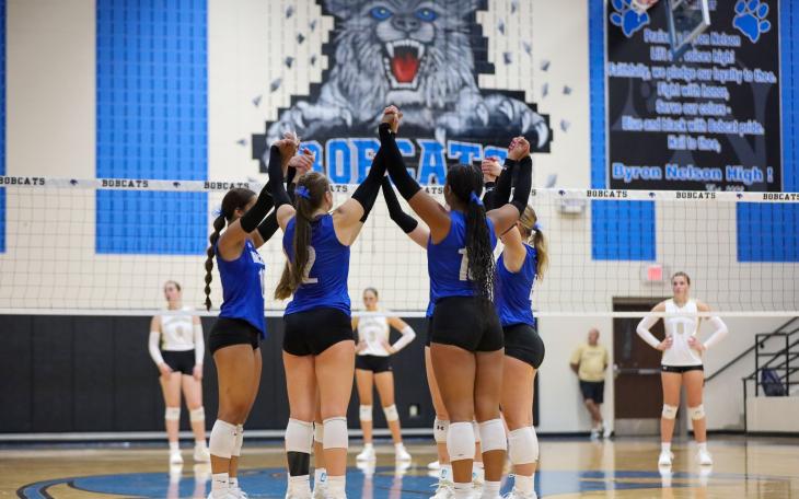 The Northwest Nelson volleyball team celebrates a point during the 2025 season.