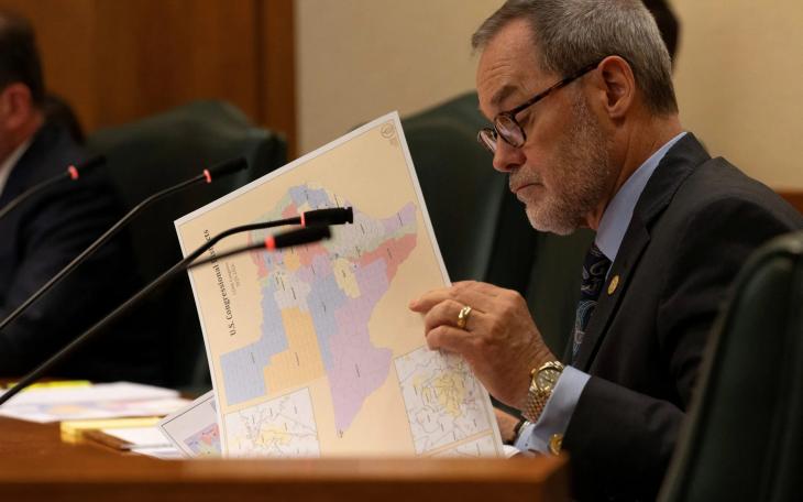 State Sen. Kevin Sparks, R-Midland, looks over a proposed congressional map during a redistricting hearing at the Texas Capitol in Austin on Aug. 6, 2025.