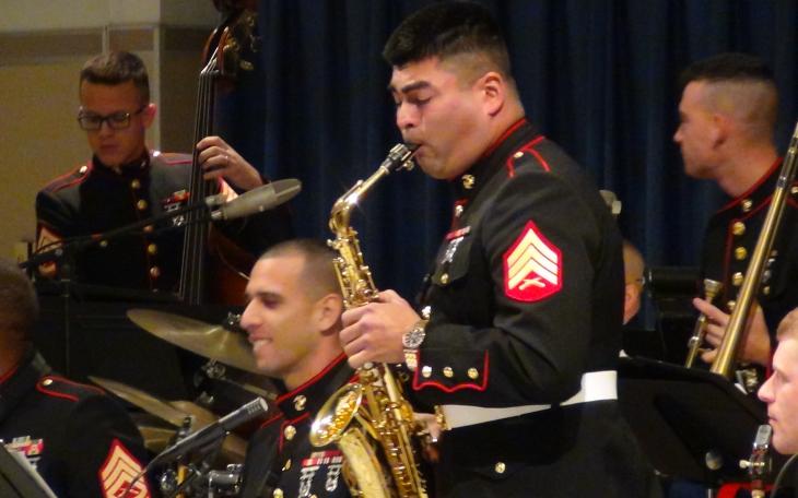A marine sax player stands up for a solo (LIVE! photo by Cheyenne Benson)