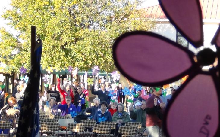 Flowers with the names of loved ones lost to Alzheimer's were carried by the walkers (LIVE! photo by Cheyenne Benson)