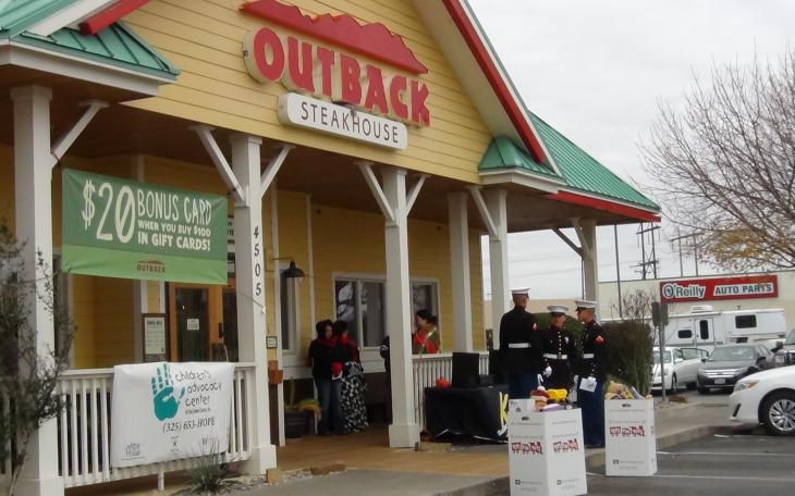 Marines await toy donations, braving the cold weather, in front of Outback Steakhouse (LIVE! photo by Cheyenne Benson)