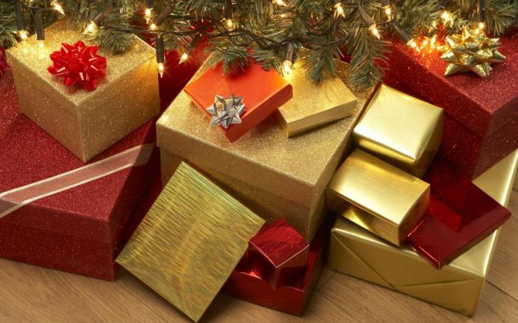 Gifts lay wrapped under a tree (photo couresty of janetprezekckles.com)