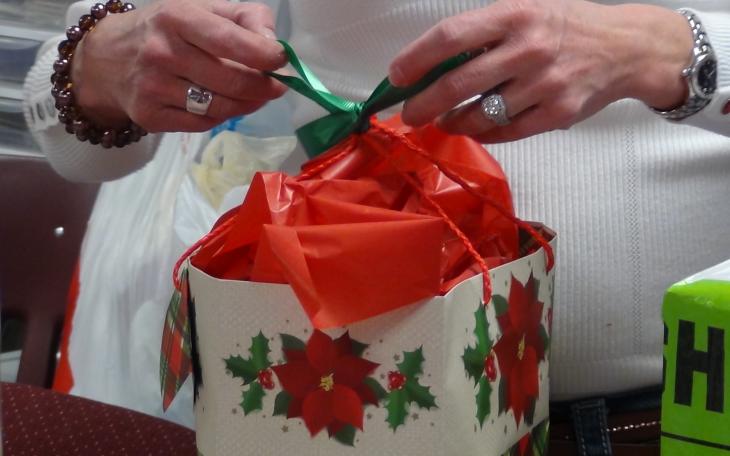 A volunteer wraps a gift (LIVE! photo by Cheyenne Benson)
