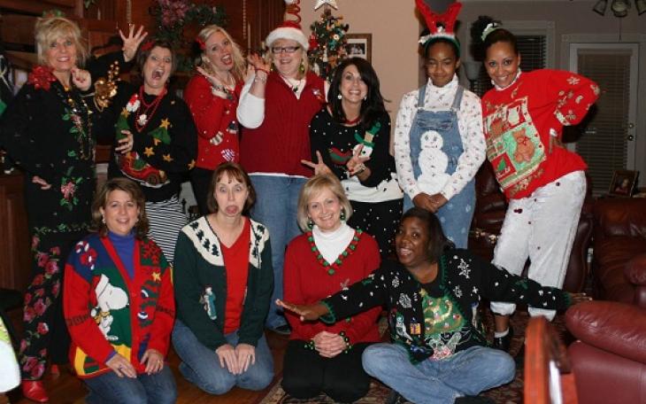 Women pose for a picture in ugly Christmas sweaters (photo courtesy of convenientbuys.com)