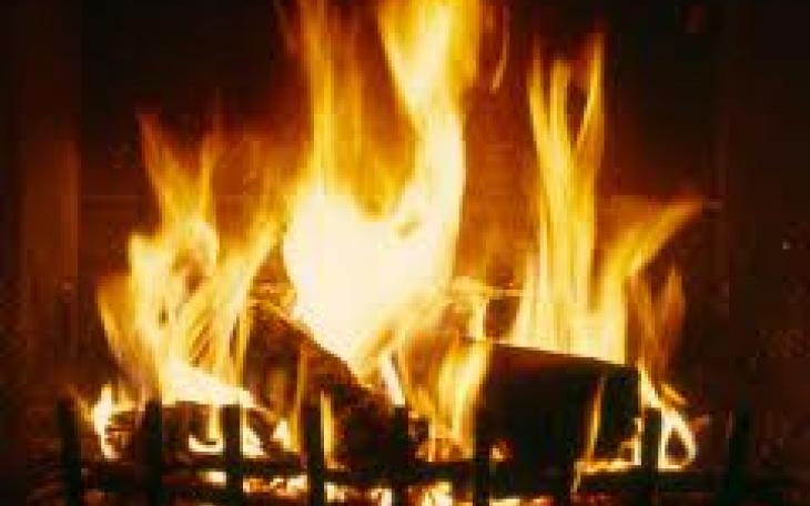 A log burns in the fireplace (photo from blogs.timeunion.com)