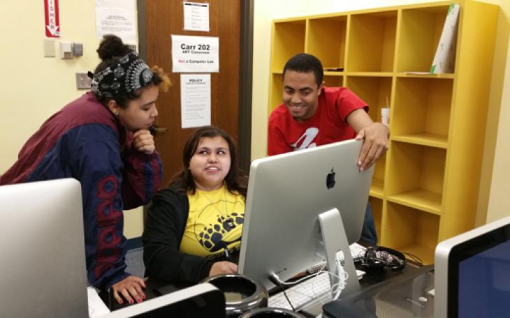 Graduating art majors Alexander Bryant and Ruth Cardenas (center) look over computer graphic design work with ASU student Lindsey Green. (Contributed Photo/Edwin Cuenco)