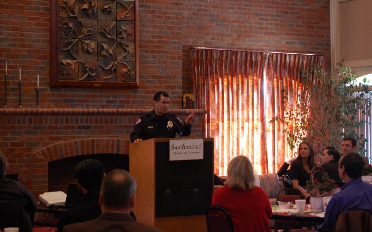 Jeneva Noah, Chase Jones and Elizabeth Espey stand before their restored tractor. (LIVE! Photo by Chelsea Schmid)