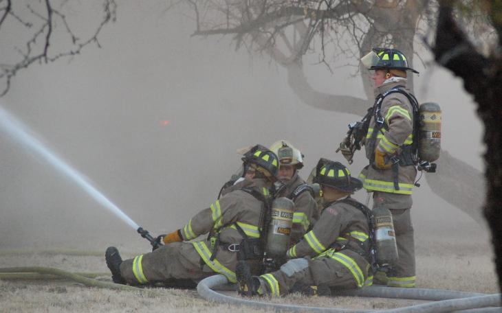 Firemen battle a house fire on Armstrong street Wednesday. (LIVE! Photo by John Basquez)