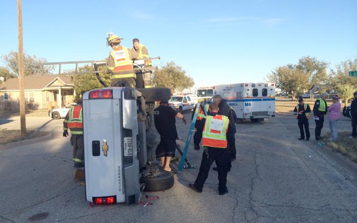 A white Chevy Silverado pickup rolled over after crashing into a red Dodge Stratus at Archer and Bryan Monday, Nov. 17, 2014. (LIVE! Photo/John Basquez)
